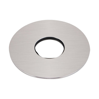 Round metallic object with a central hole on a white background