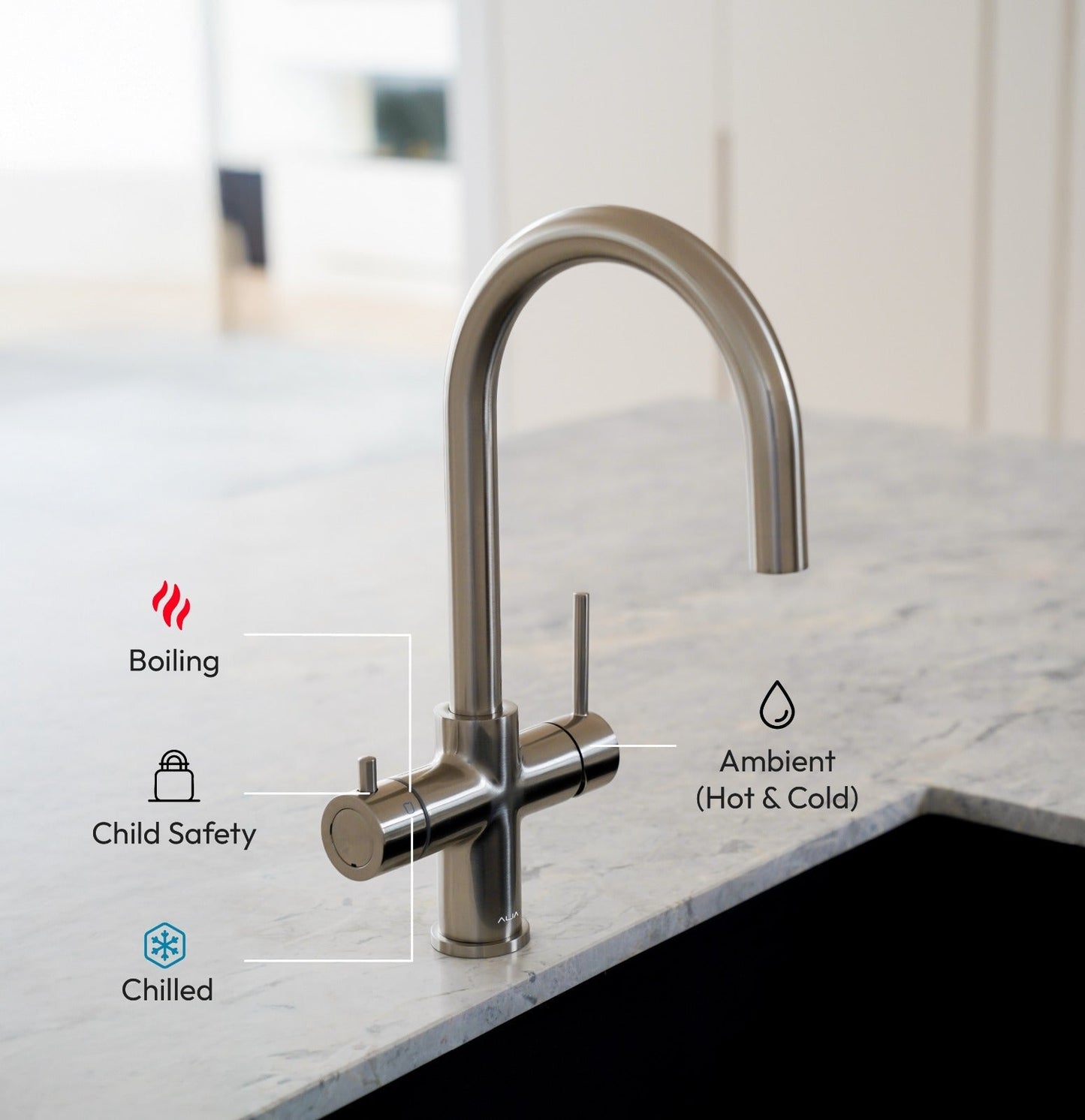 Modern Alia 4-in-1 Hot and cold water tap - kitchen faucet with Hot, cold, child safety and Ambient function icons - on a marble countertop