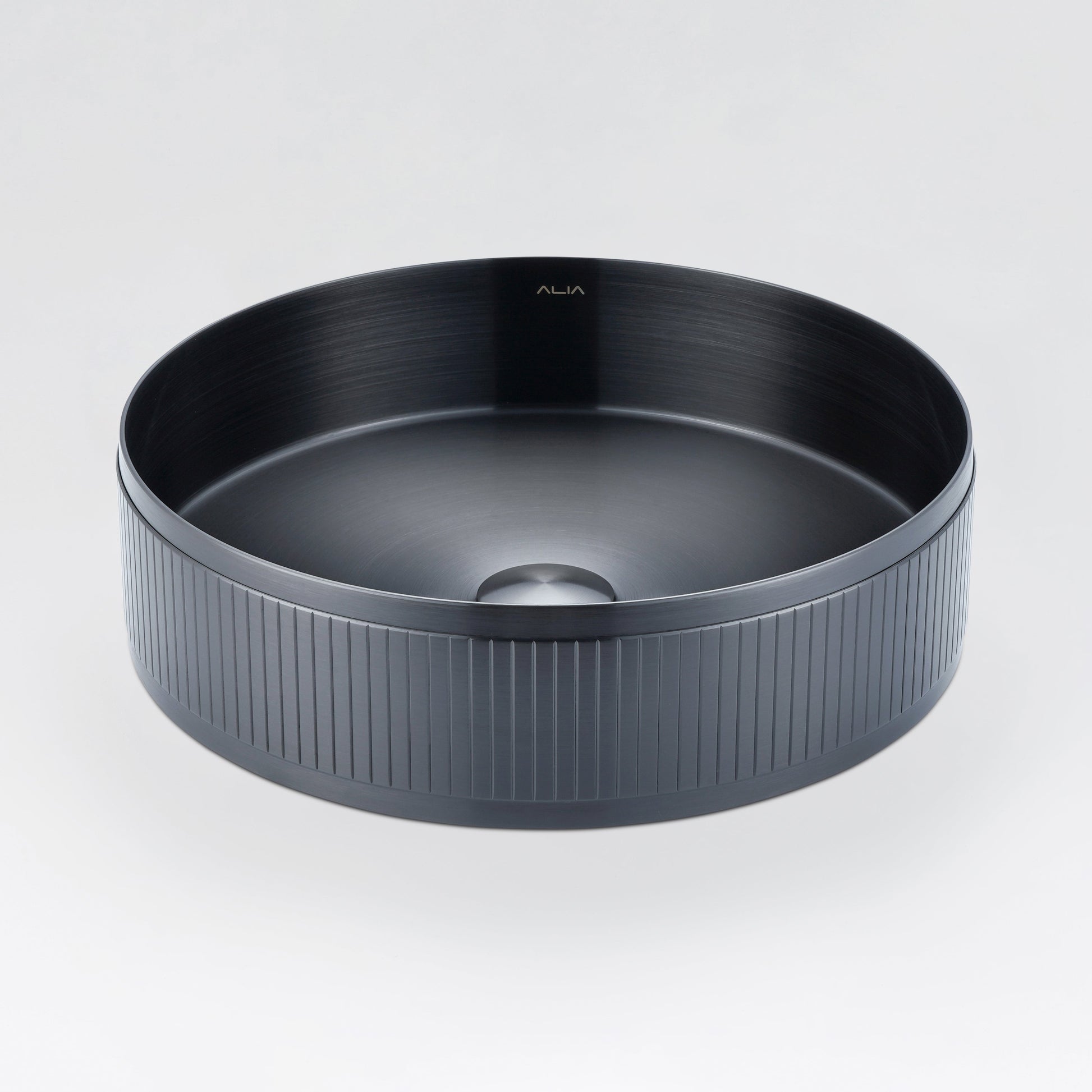 ALIA textured gunmetal grey above-counter basin designed for statement bathroom interiors with a contemporary edge.